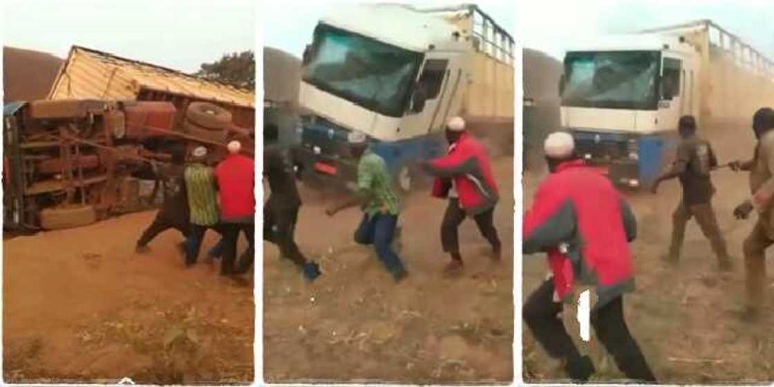 5 Nigerian men pulling up fallen lorry with the use of ropes 5 Nigerian men pulling up fallen lorry with the use of ropes