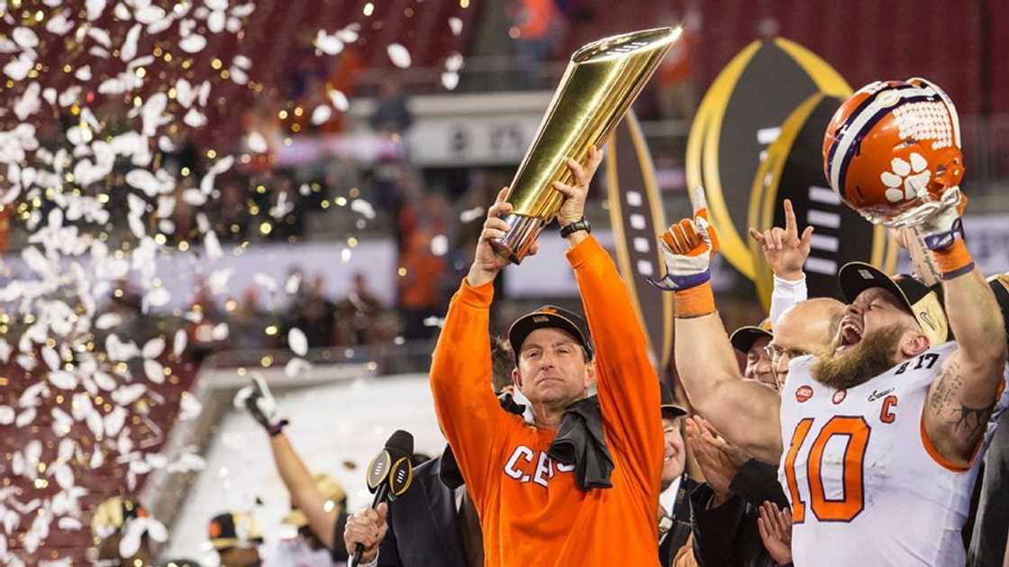 Dabo Swinney holding up the trophy