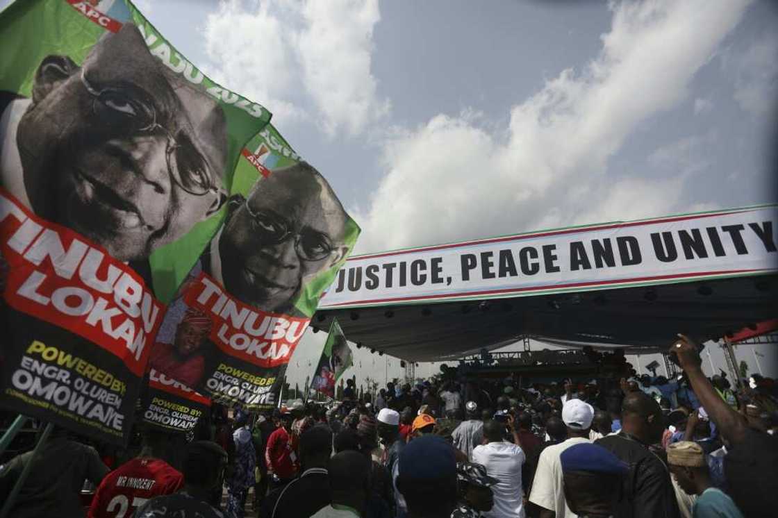 Former Lagos governor Bola Tinubu, seen here in a campaign poster, is facing three major rivals in the February 25 election