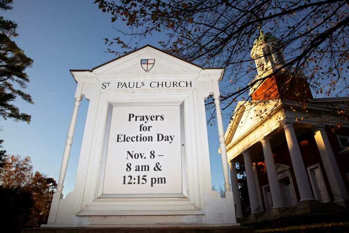 A sign displays "Prayers for Election Day" at St. Paul’s Church in Charlottesville, Virginia, on November 7, 2022 on the eve of the US midterm elections A sign displays "Prayers for Election Day" at St. Paul’s Church in Charlottesville, Virginia, on November 7, 2022 on the eve of the US midterm elections