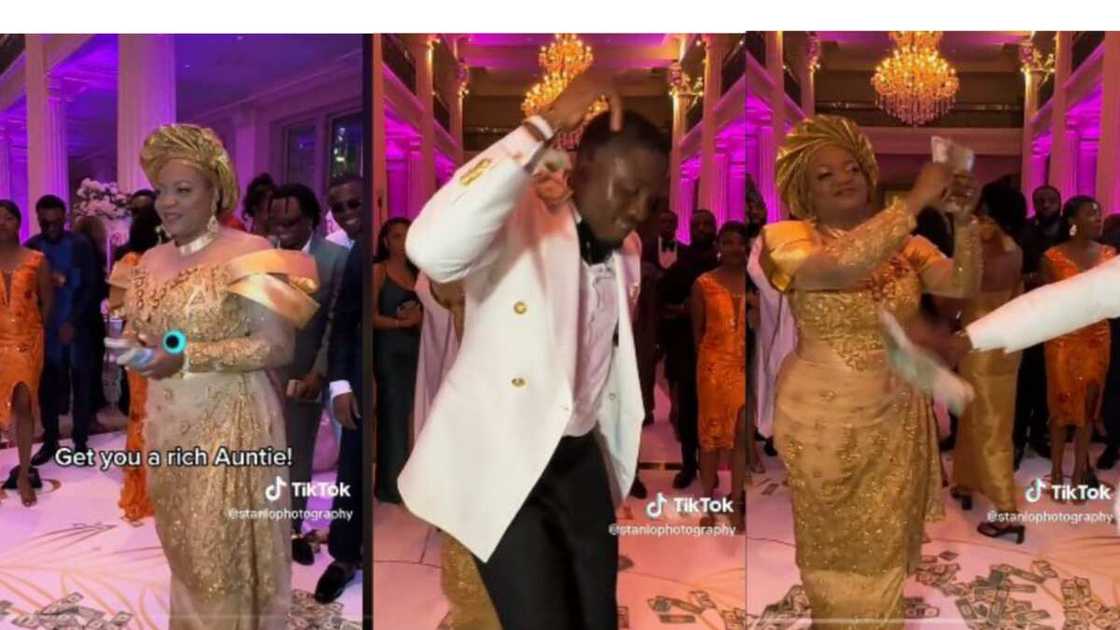 Auntry sprays dollars at wedding