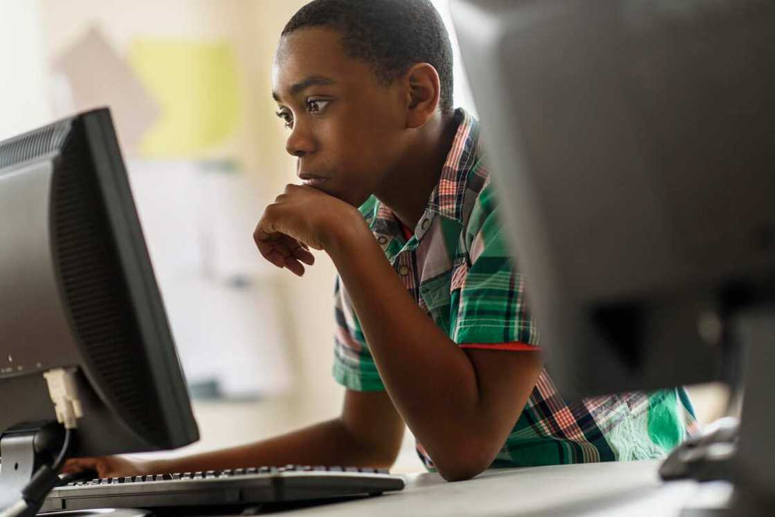 A young man using a computer