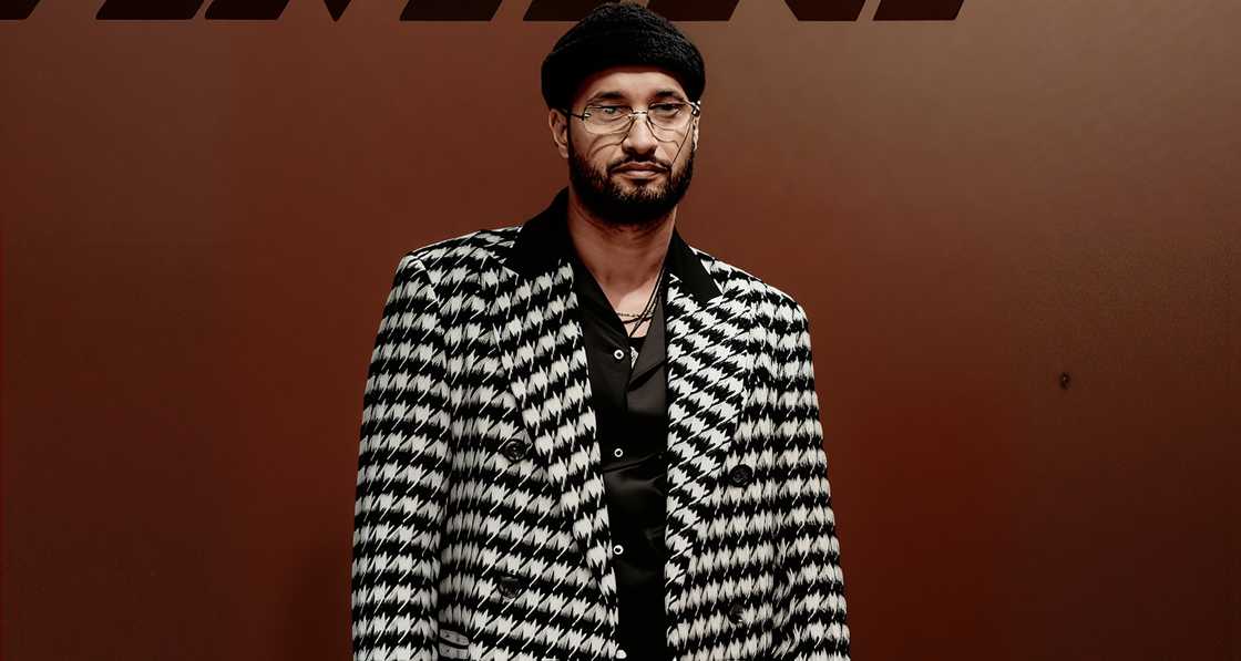 Soolking poses in a black and white outfit at the 2025 Paris Fashion Week. Soolking poses in a black and white outfit at the 2025 Paris Fashion Week.