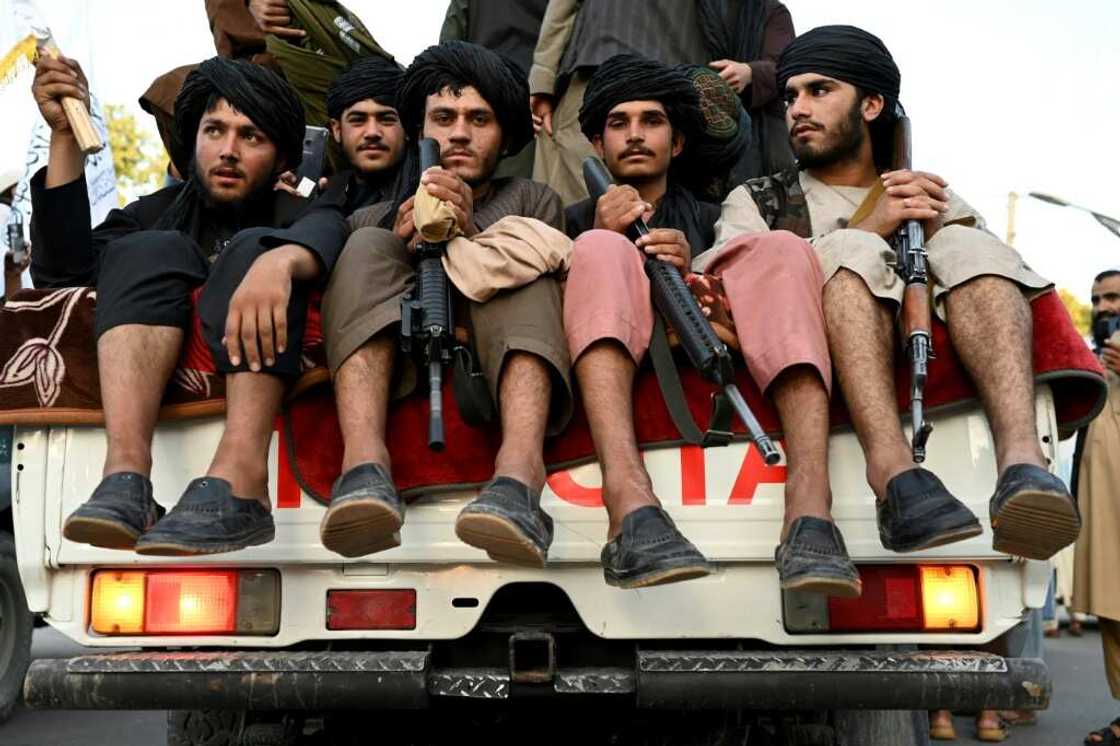 Taliban fighters in the back of a pick-up truck in Kabul, where a suicide bomber killed at least two people in an attack outside the Russian embassy Taliban fighters in the back of a pick-up truck in Kabul, where a suicide bomber killed at least two people in an attack outside the Russian embassy