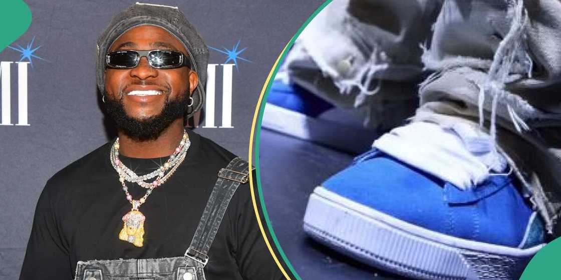 Davido wears shoe given to him by a fan.