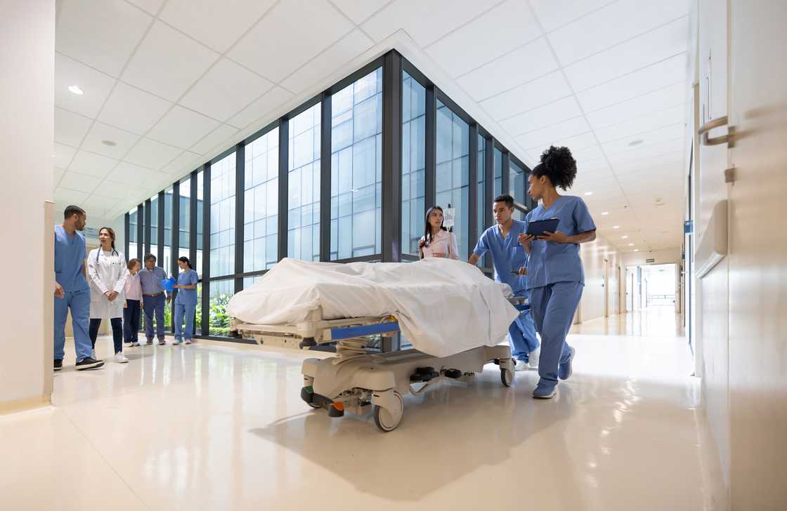 A patient is being taken to the ward A patient is being taken to the ward