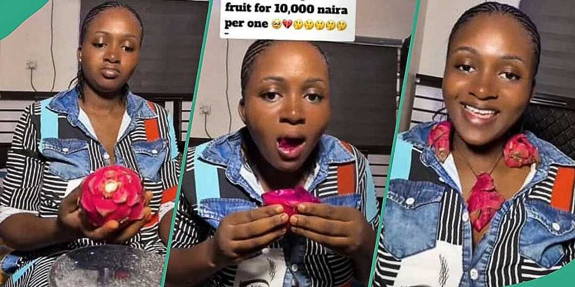 Woman displays costly dragon fruit Woman displays costly dragon fruit