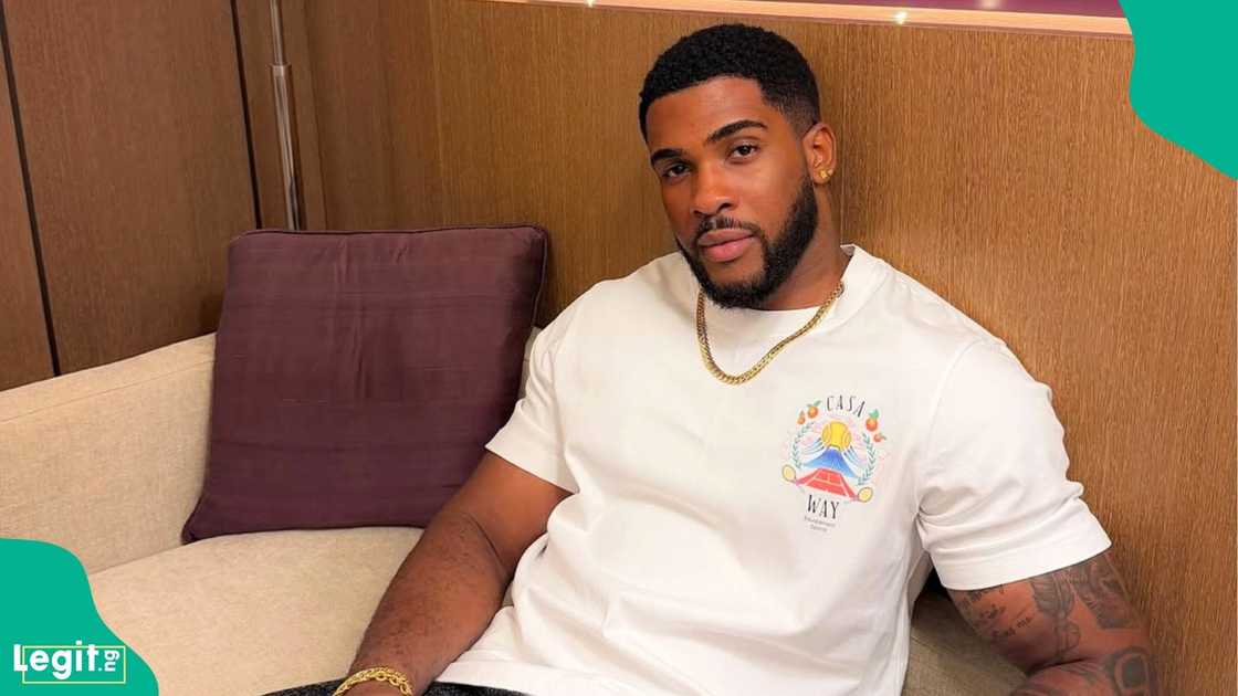 Former BBNaija housemate Bright Morgan honours veteran actor Bob Manuel Udokwu during a movie shoot
