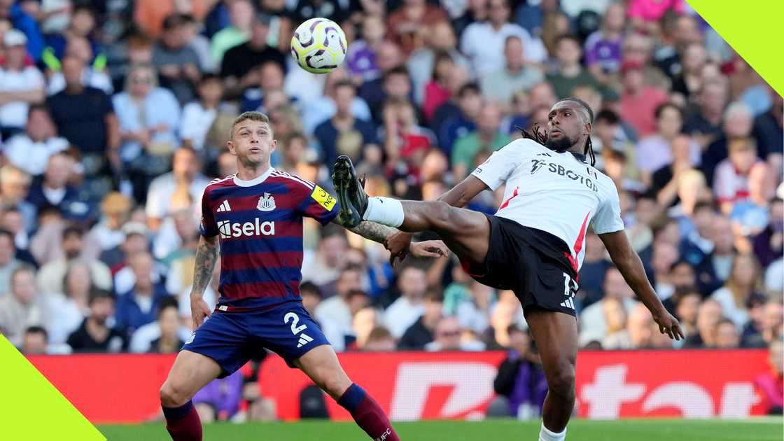 Alex Iwobi fuels for the ball against Newcastle's Keiran Trippier.