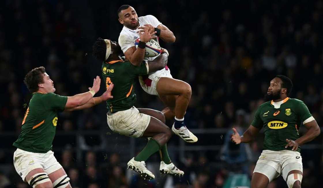 South Africa captain Siya Kolisi (2L) contests possession with England wing Joe Marchant (2R) in a November 2021 Test which England won 27-26 in London South Africa captain Siya Kolisi (2L) contests possession with England wing Joe Marchant (2R) in a November 2021 Test which England won 27-26 in London