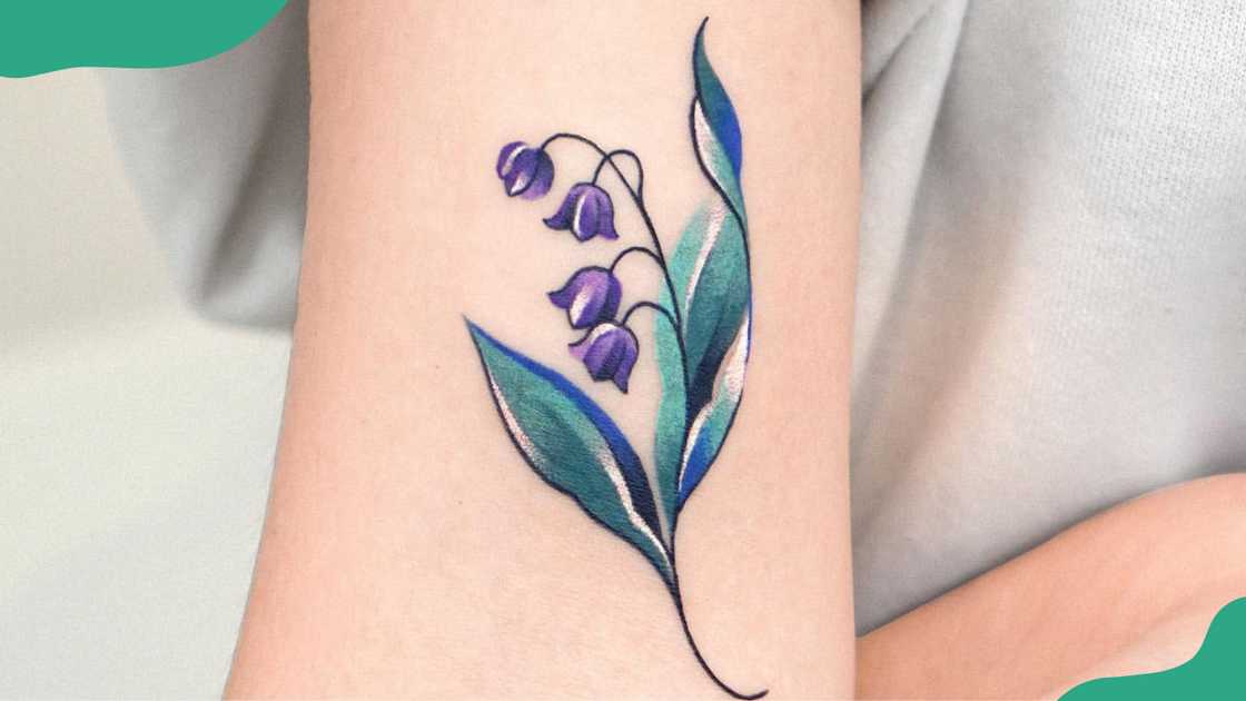 Abstract Lily of the Valley biceps tattoo