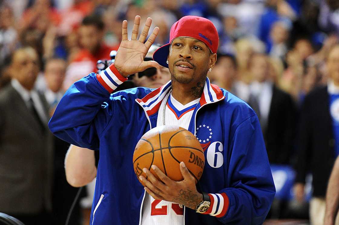 Allen Iverson walks onto the court to deliver the game ball in 2012