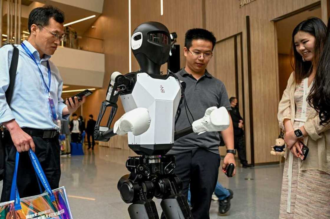 Bipedal robots stomp around the room at the 2024 China Humanoid Robot Developers Conference in Shanghai Bipedal robots stomp around the room at the 2024 China Humanoid Robot Developers Conference in Shanghai