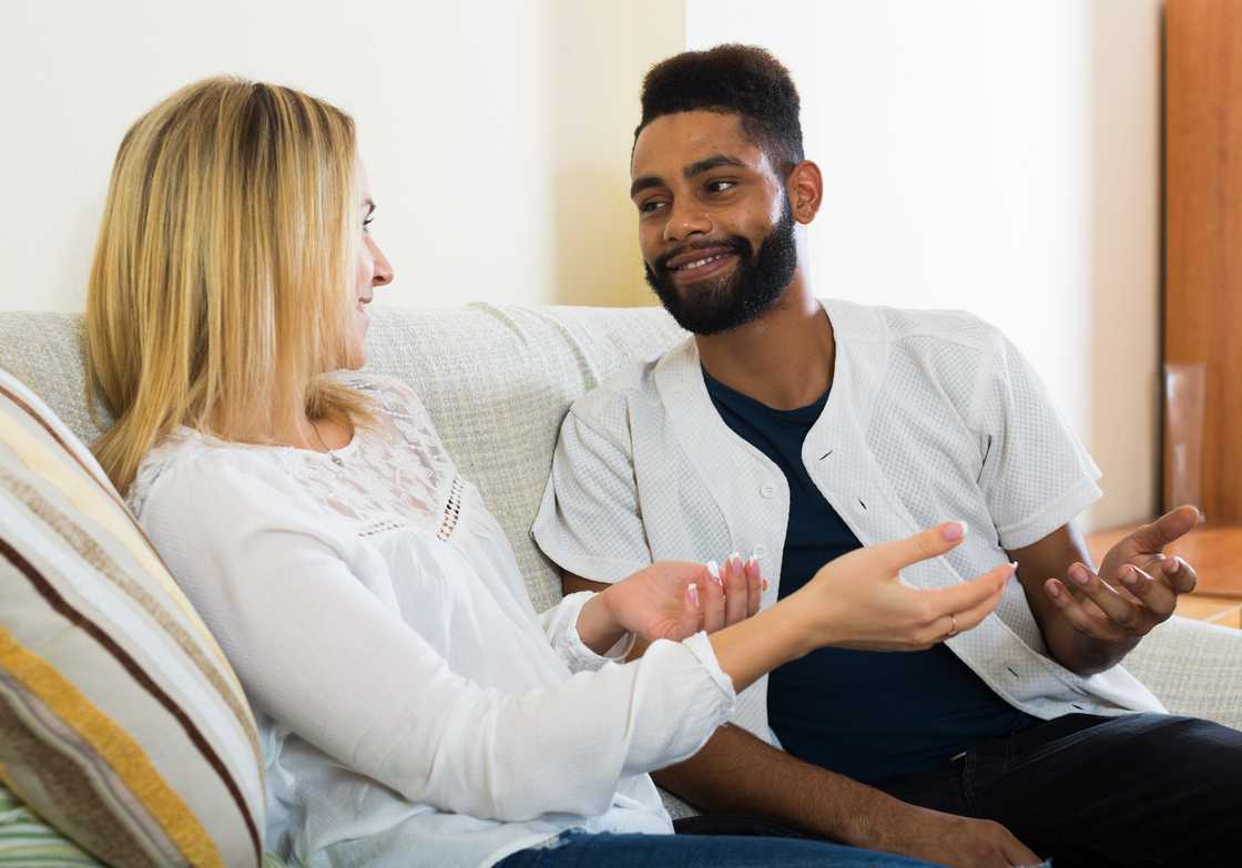 A happy spouses playing a game indoors