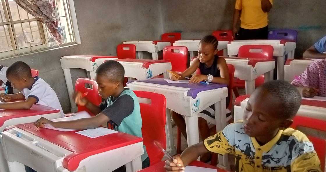 Students sitting for National Common Entrance Examination in a large hall Students sitting for National Common Entrance Examination in a large hall