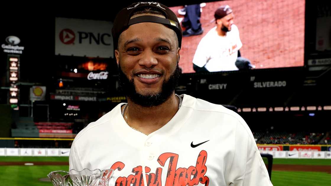 Robinson Cano poses with the Home Run Derby trophy.