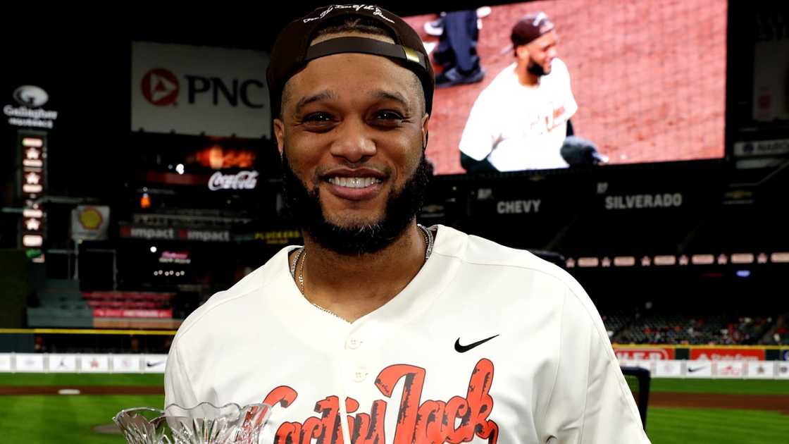 Robinson Cano poses with the Home Run Derby trophy. Robinson Cano poses with the Home Run Derby trophy.