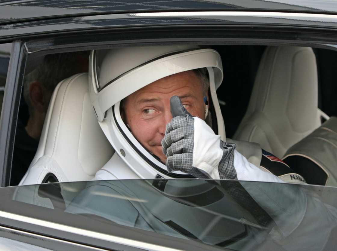 Flight commander Nick Hague of NASA gives a thumbs up to family members before heading to the launch pad at the Kennedy Space Center in Florida Flight commander Nick Hague of NASA gives a thumbs up to family members before heading to the launch pad at the Kennedy Space Center in Florida