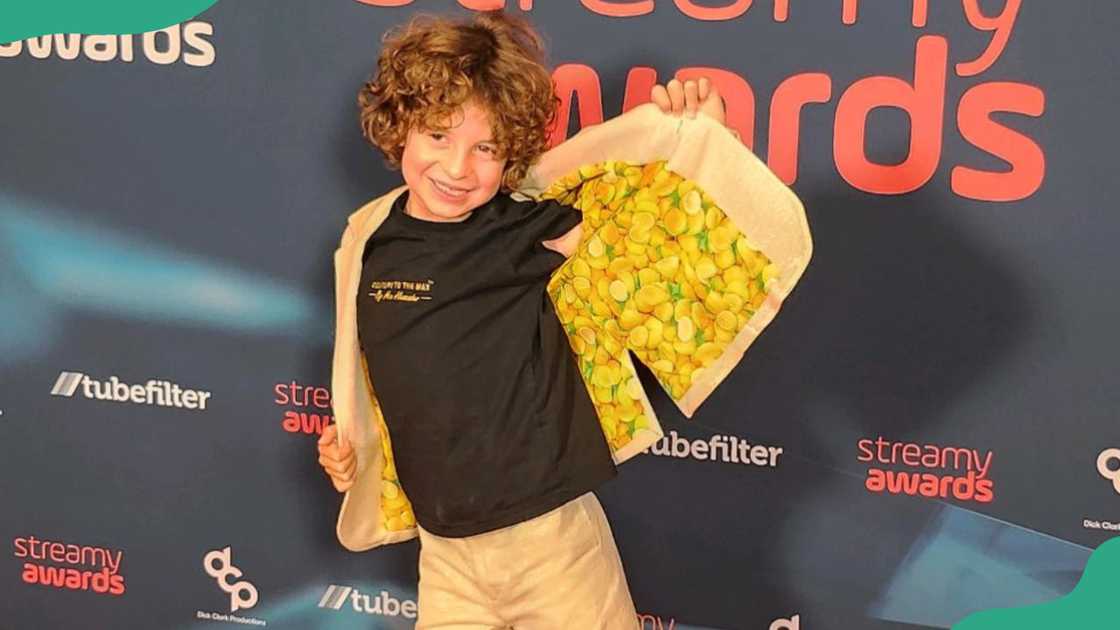 Max Alexander poses for a photo at a fashion event Max Alexander poses for a photo at a fashion event