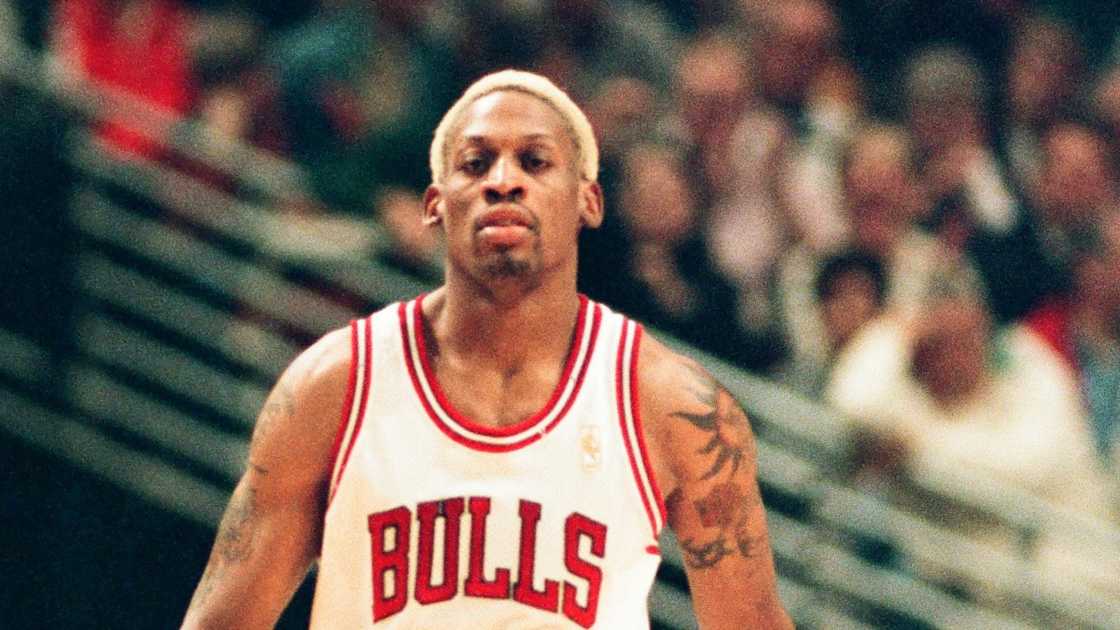 Dennis Rodman of the Chicago Bulls walks on the court