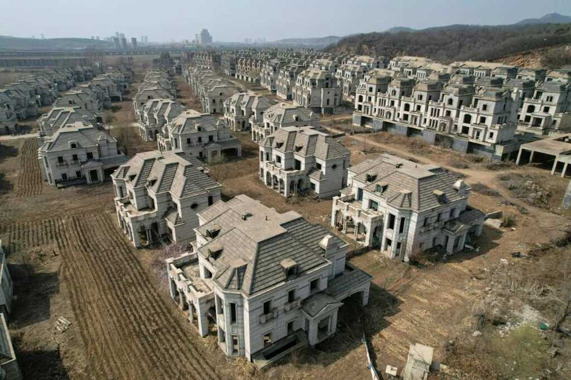 A luxury complex in Shenyang whose crumbling verandas and overgrown arches are stark symbols of a housing market in China crippled by its own excess A luxury complex in Shenyang whose crumbling verandas and overgrown arches are stark symbols of a housing market in China crippled by its own excess