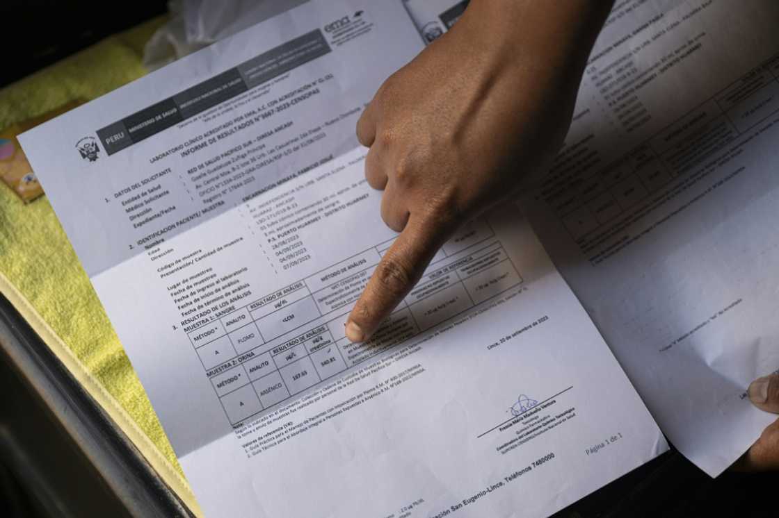 Mireya Minaya shows the blood test results of her son Fabricio Mireya Minaya shows the blood test results of her son Fabricio