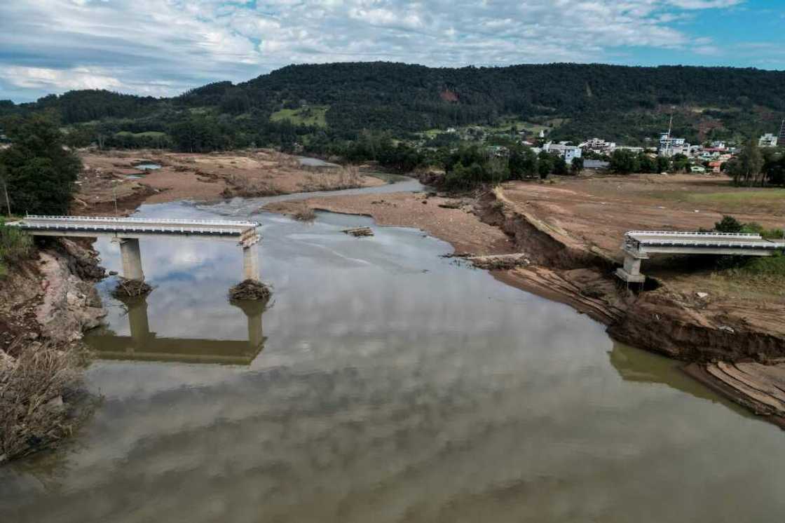 Multiple bridges collapsed in the flooding and roads are in a dire state, making the transportation of goods extremely difficult and preventing the resumption of business