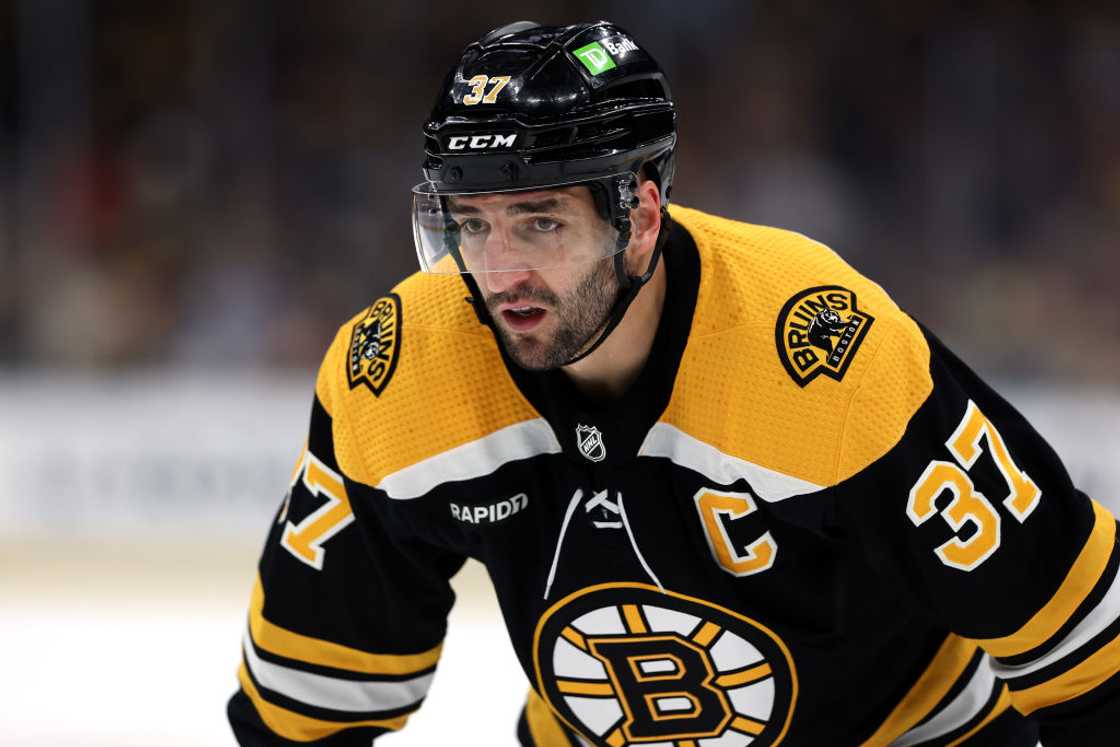 Patrice Bergeron, #37 of the Boston Bruins looks on during a game Patrice Bergeron, #37 of the Boston Bruins looks on during a game