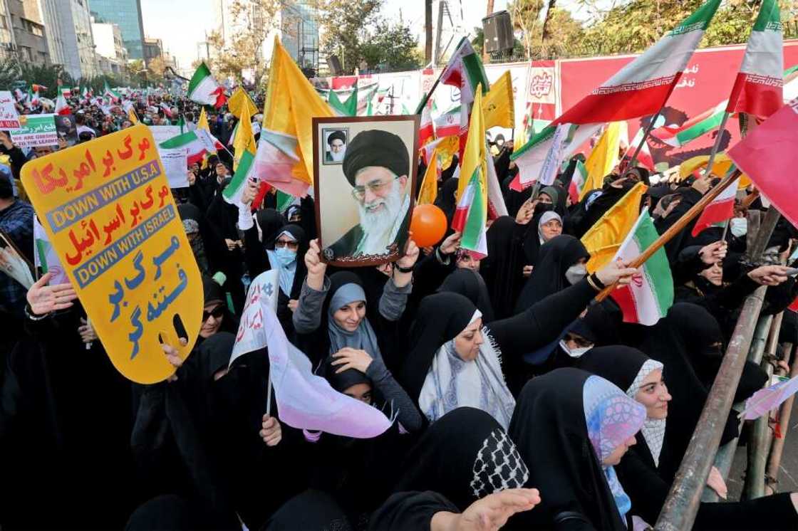 Pro-government protesters gather outside the former US embassy in Tehran Pro-government protesters gather outside the former US embassy in Tehran