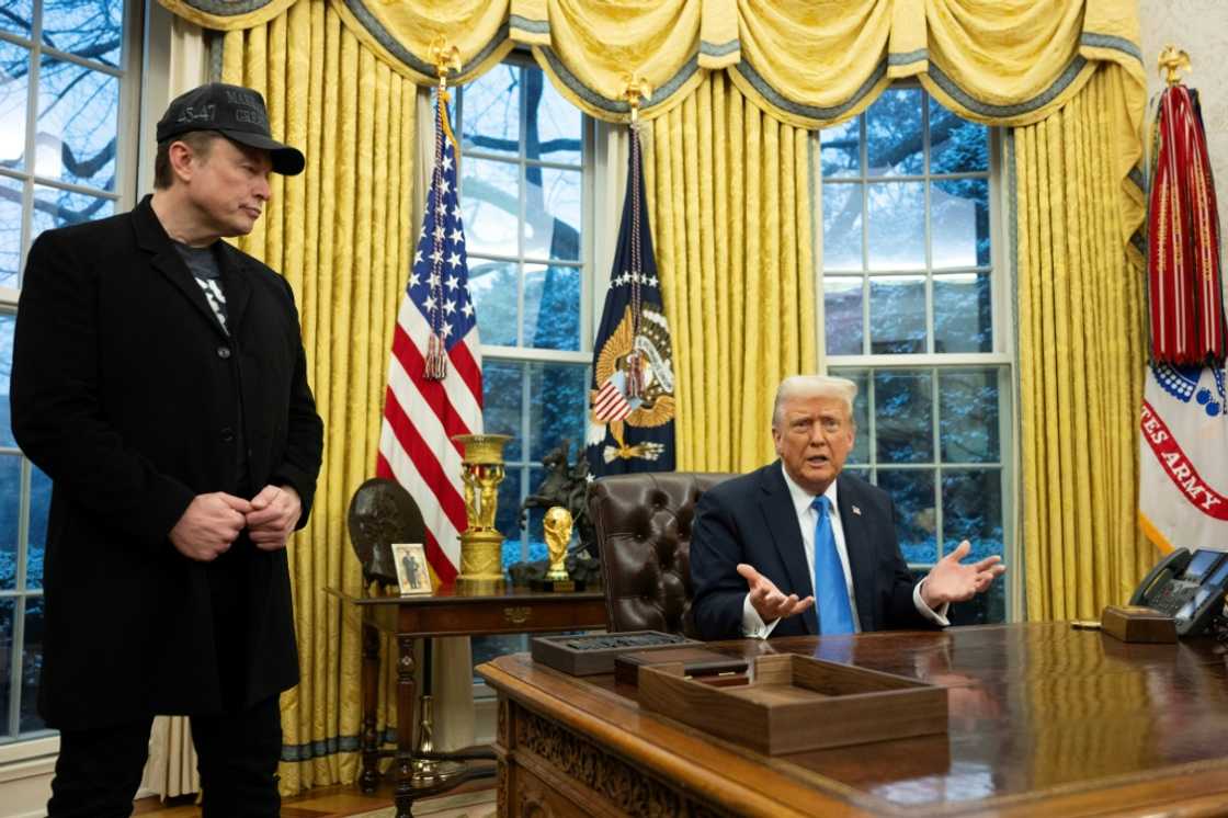 Tesla and SpaceX founder Elon Musk listens as US President Donald Trump speaks to reporters in the Oval Office of the White House Tesla and SpaceX founder Elon Musk listens as US President Donald Trump speaks to reporters in the Oval Office of the White House
