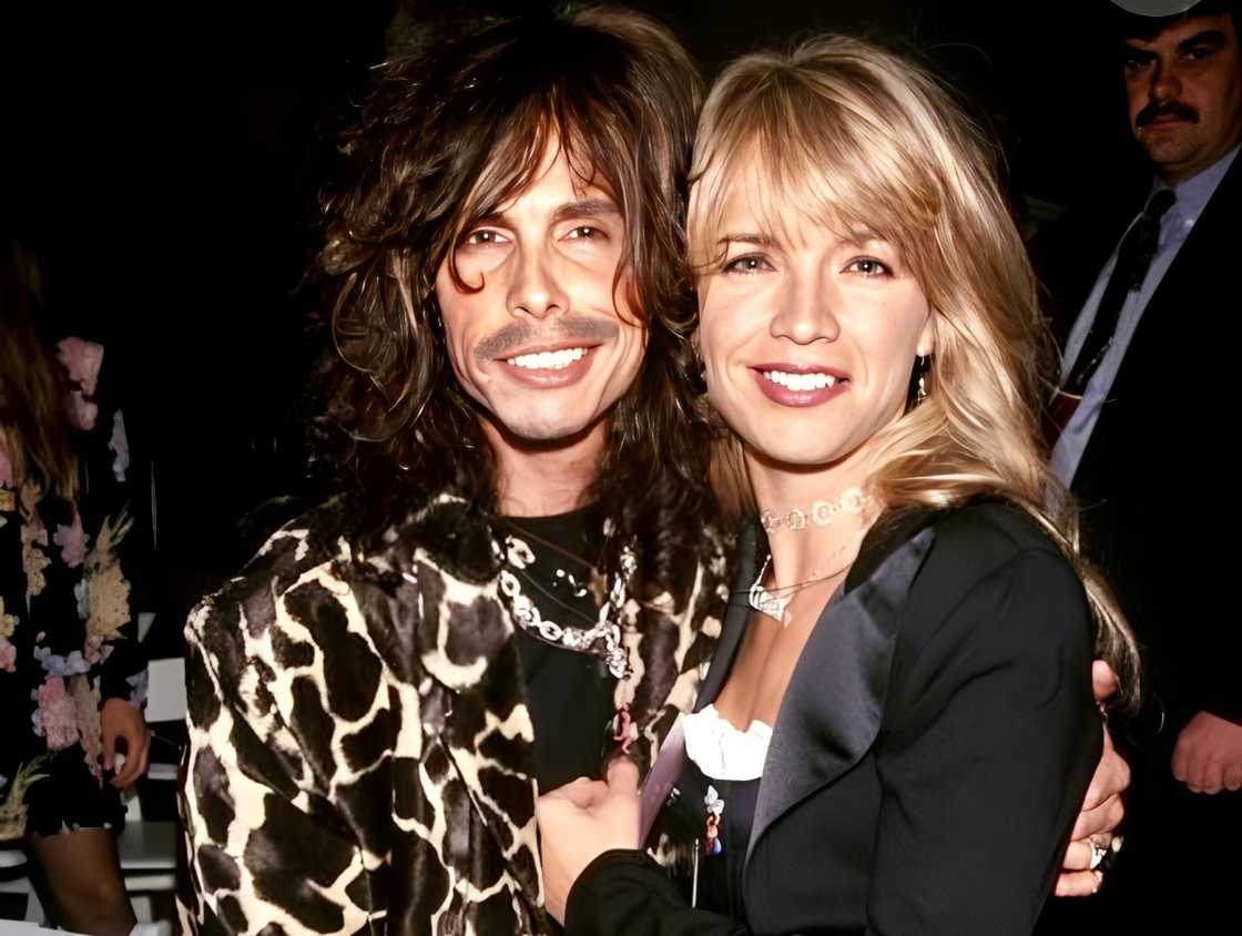 Steven Tyler posing with Teresa Barrick at an event Steven Tyler posing with Teresa Barrick at an event