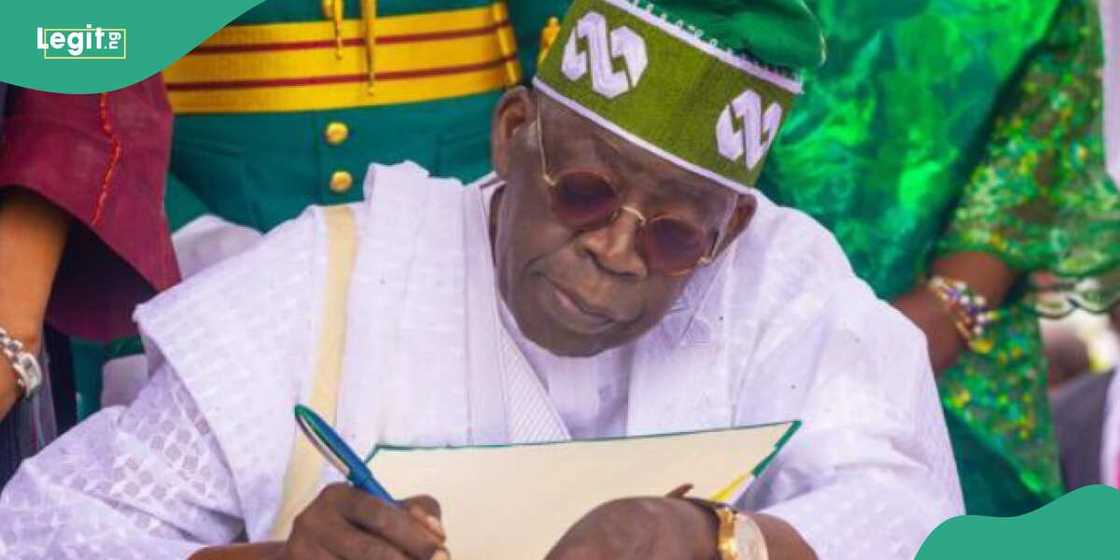 Tinubu signs Tinubu signs