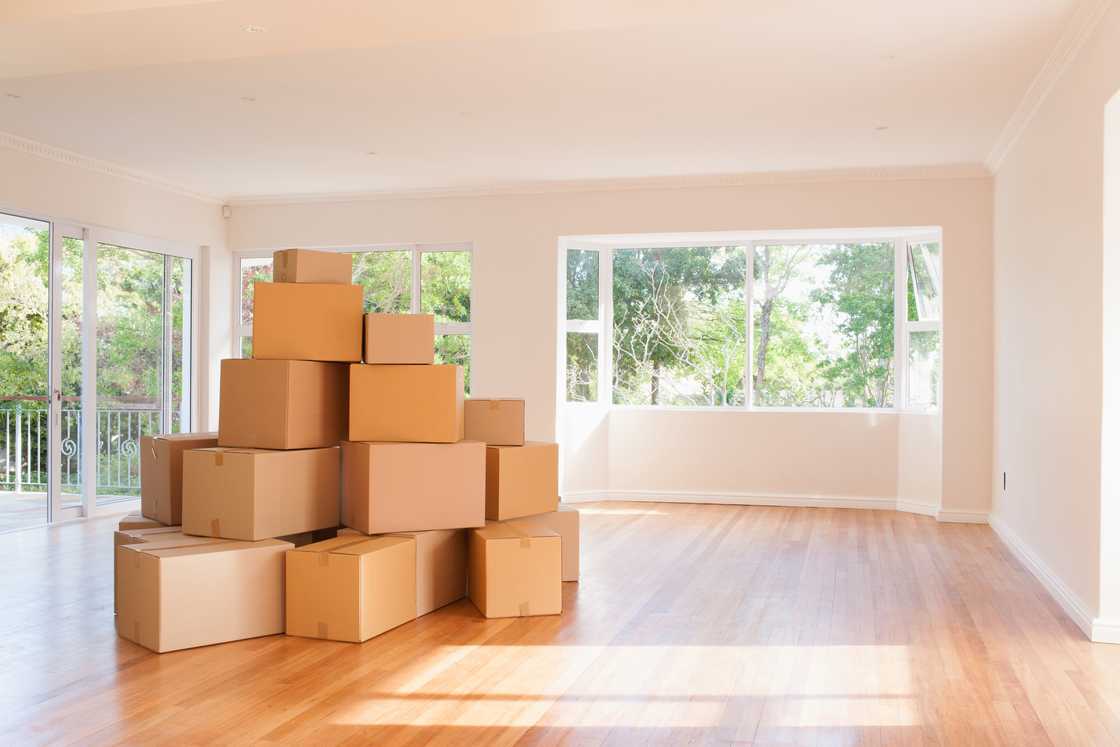Boxes are stacked in a room