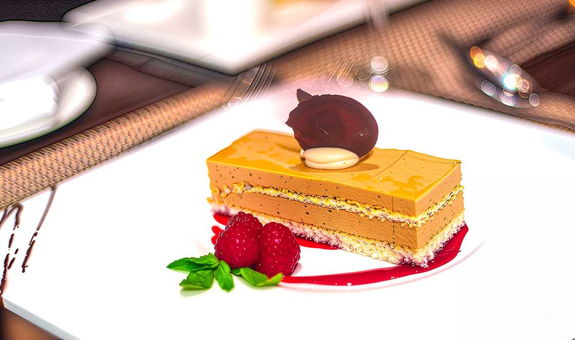 A plate of cake with mousse and fruity toppings served at Ekaabo Restaurant and Terrace A plate of cake with mousse and fruity toppings served at Ekaabo Restaurant and Terrace