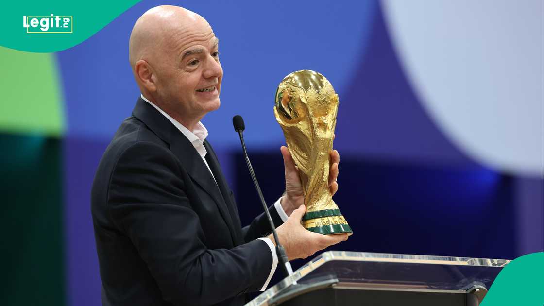 FIFA President Gianni Infantino holds the World Cup trophy. Photo by Sam Hodde