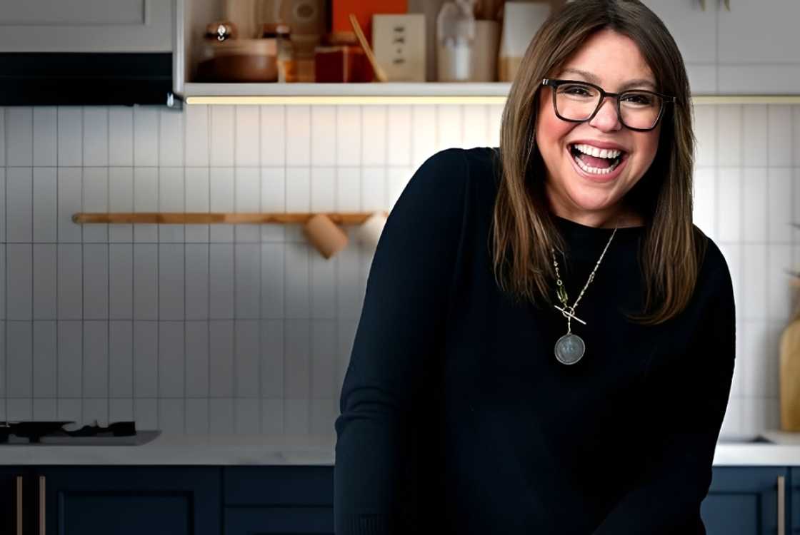 Rachael Ray laughs in a kitchen