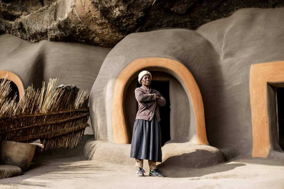 The cave is divided into several round houses propped against the basalt rock