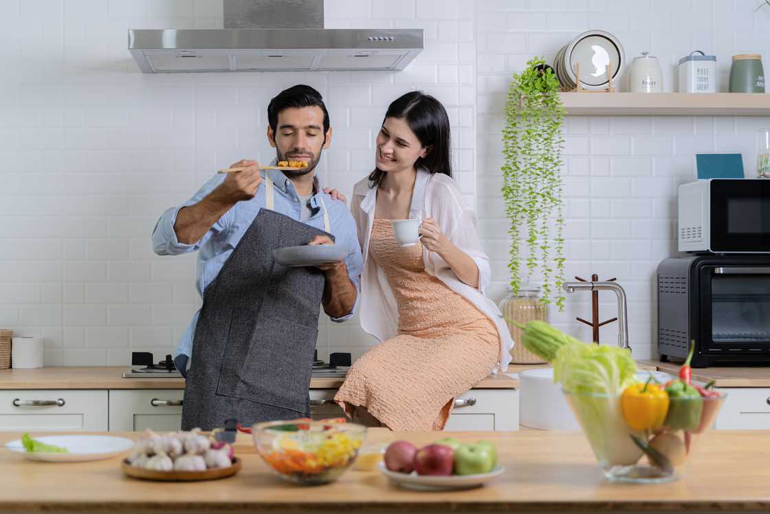 Couple preparing a breakfast together. Couple preparing a breakfast together.