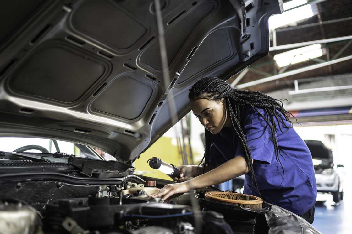 A female mechanic busy at work