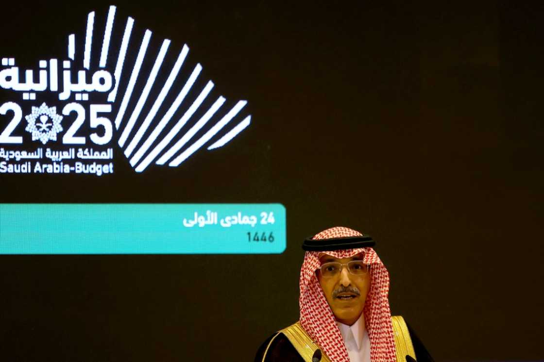 Saudi Finance Minister Mohammed al-Jadaan unveils the kingdom's budget for 2025 at a news conference in Riyadh.