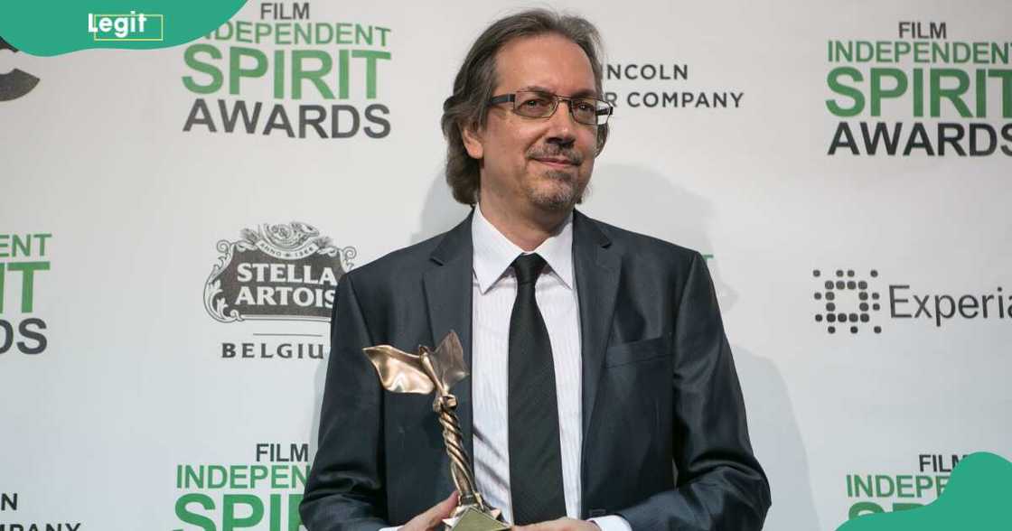 Bob Nelson poses with an award at the Independent Spirit Awards