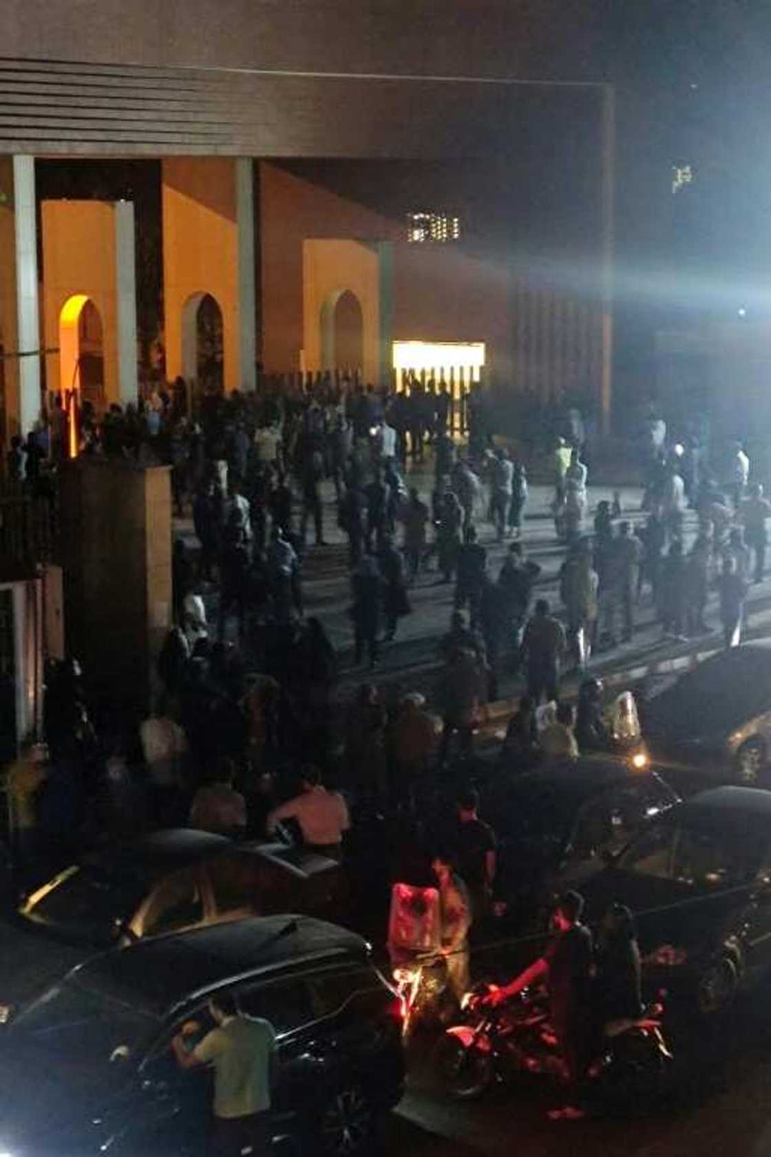 Crowds gather outside Tehran's Sharif University of Technology where clashes erupted overnight, in an image from a video clip made available on October 2, 2022 Crowds gather outside Tehran's Sharif University of Technology where clashes erupted overnight, in an image from a video clip made available on October 2, 2022
