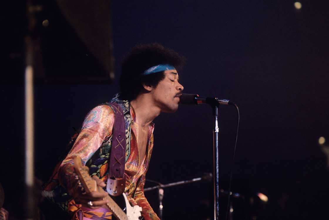 Jimi Hendrix playing the guitar.