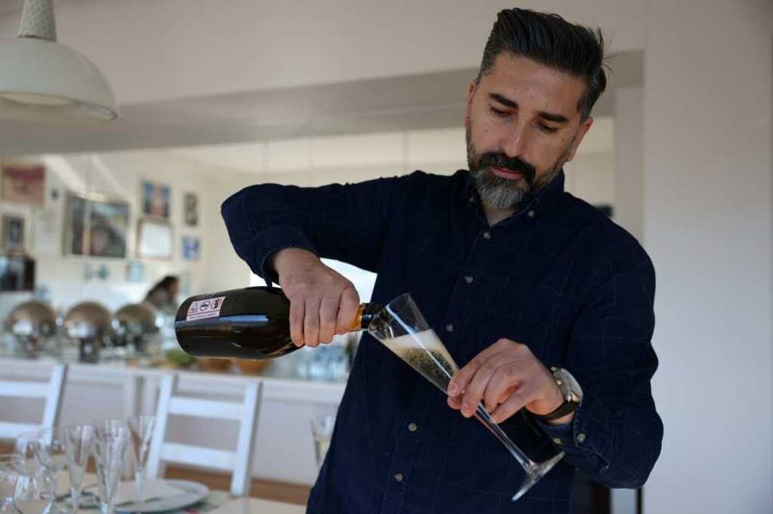 Ahmet Ay, of the Vinkara winery, pours a glass of sparkling wine Ahmet Ay, of the Vinkara winery, pours a glass of sparkling wine
