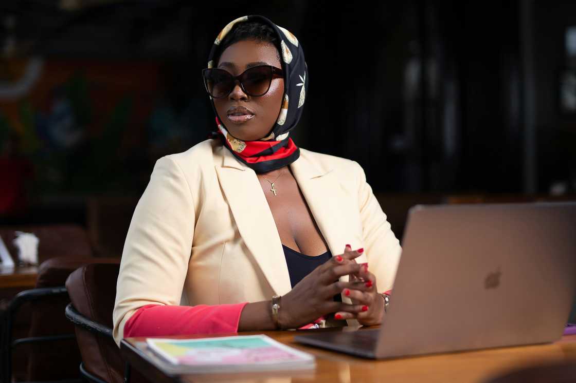 A black woman in a head scarf