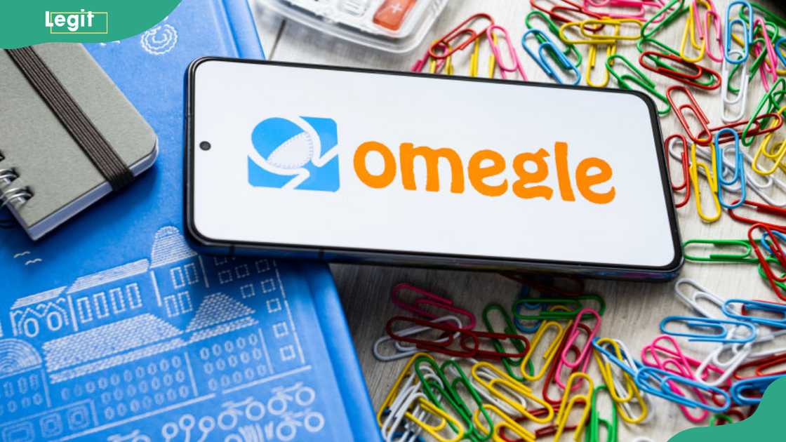 A smartphone displaying Omegle logo A smartphone displaying Omegle logo