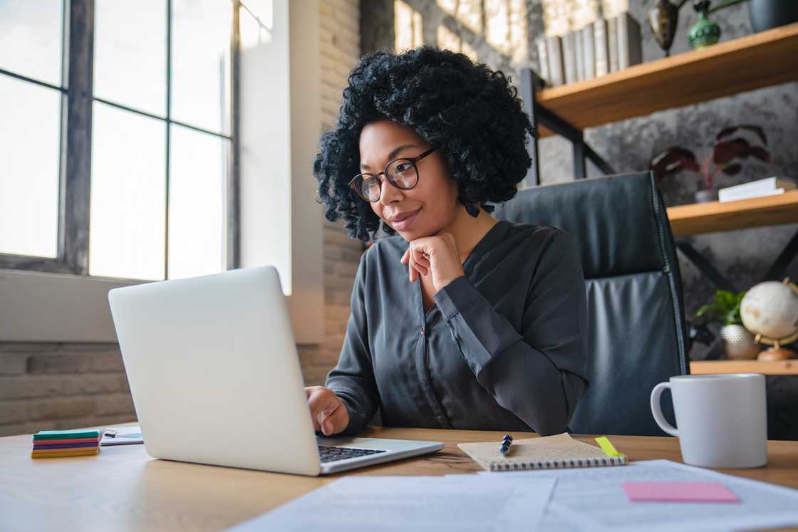 A young woman in a modern home office.