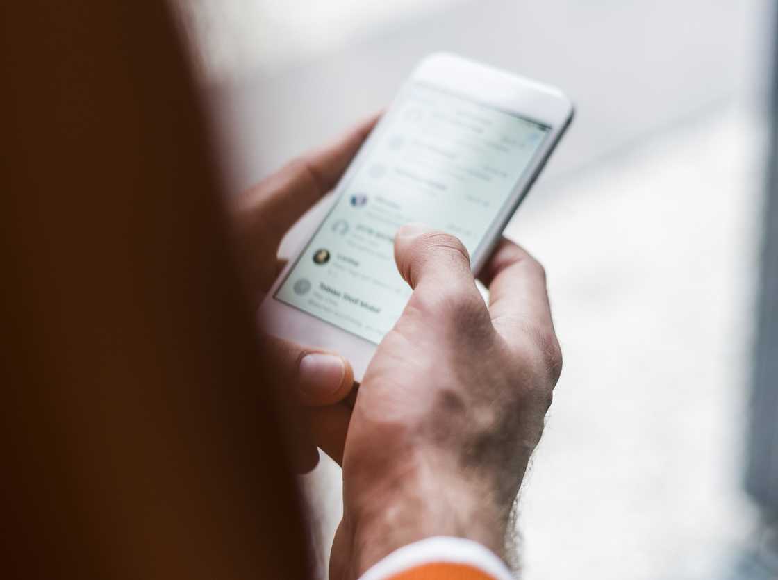 Close-up of man using smartphone