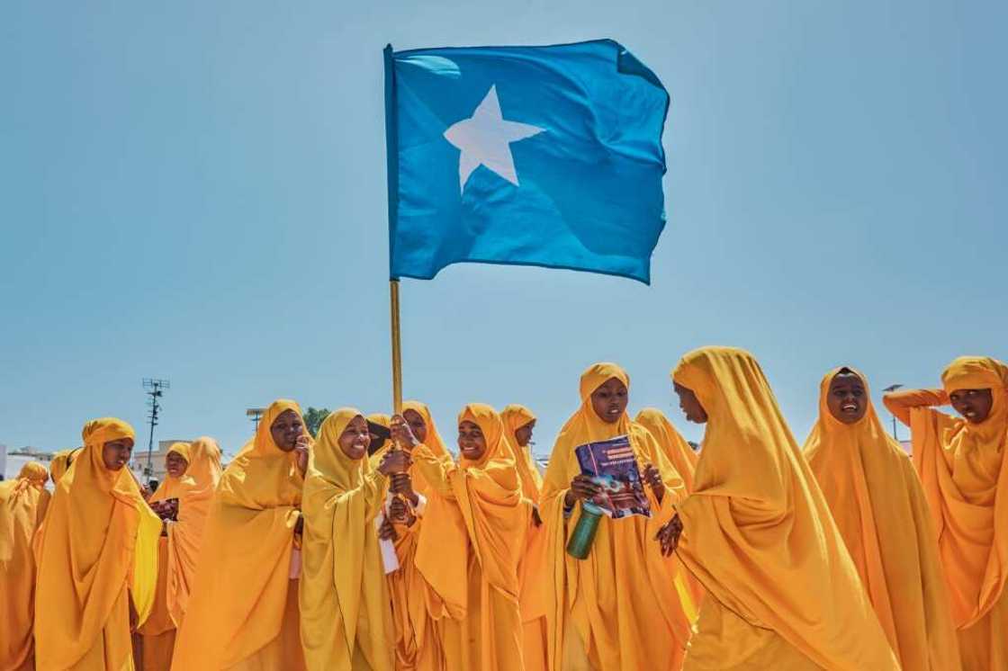 Students wave a Somali flag during a demonstration in support of the government over the controversial deal between Ethiopia and the breakaway region of Somaliland Students wave a Somali flag during a demonstration in support of the government over the controversial deal between Ethiopia and the breakaway region of Somaliland