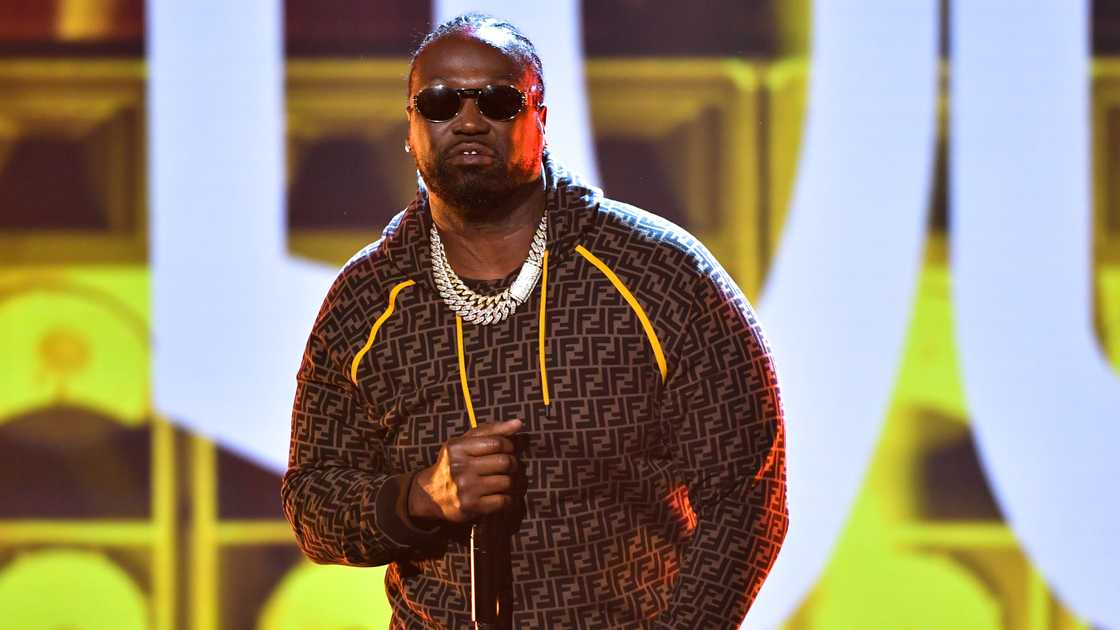 Project Pat was pictured standing as he performs onstage